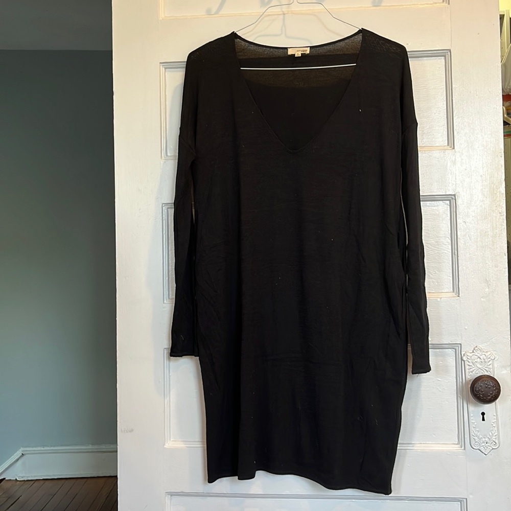 Long sleeve v-neck black cotton dress with pockets! Very comfortable.